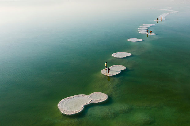 Salt islets exposed by the receding water of the Dead Sea. Photo: Kobi Wolf
