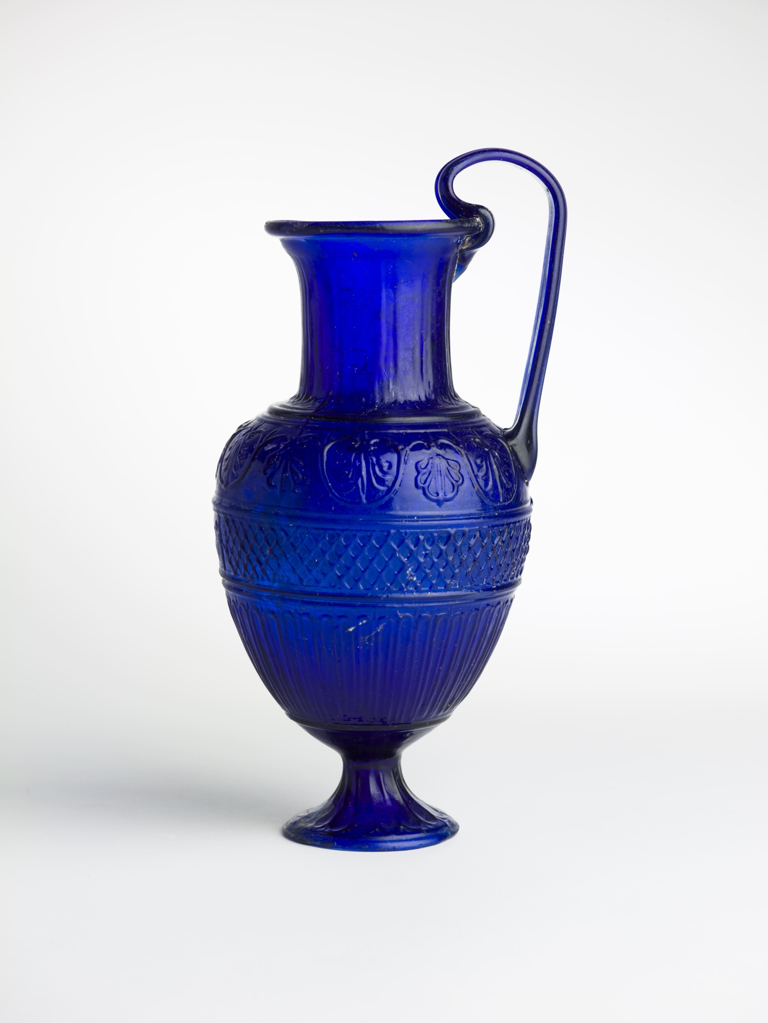 Ennion’s Blue Jug Phoenicia (present-day Lebanon), first half of the 1st century CE (Early Roman period). Photo: Meidad Suchowolski